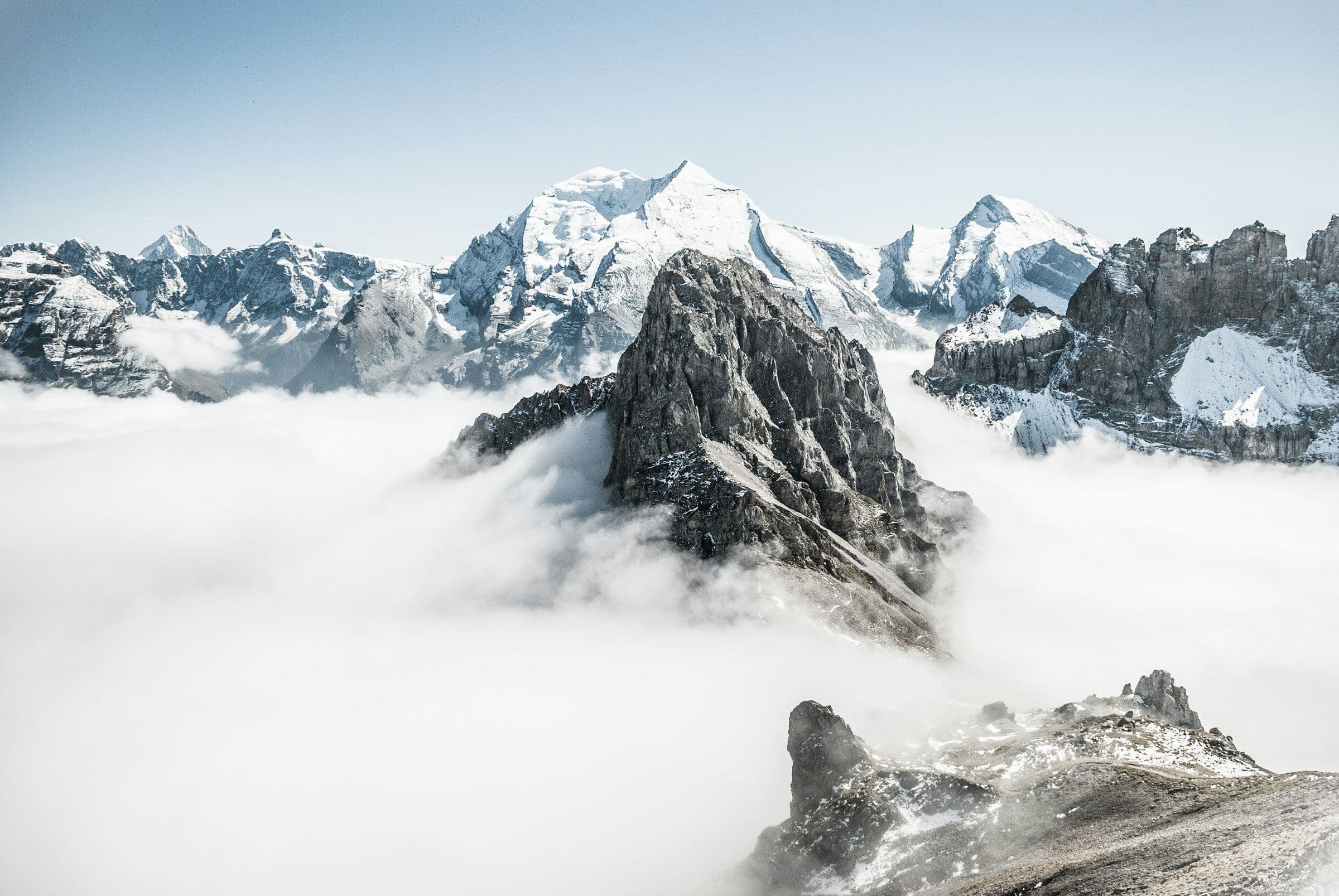 Summits rising above a sea of clouds
