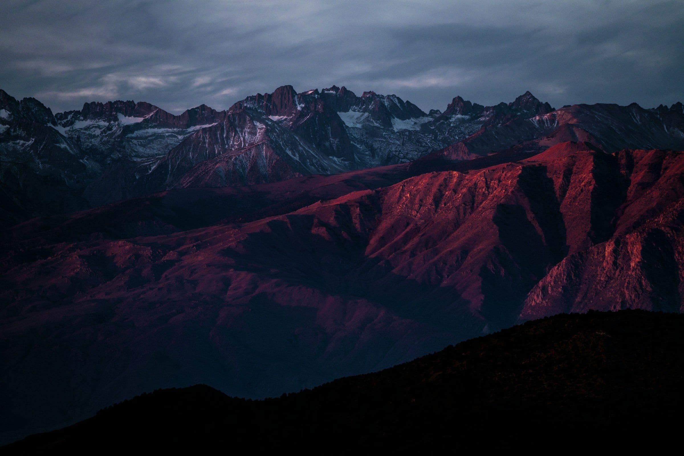 Dusk light over a jagged Himalayan skyline