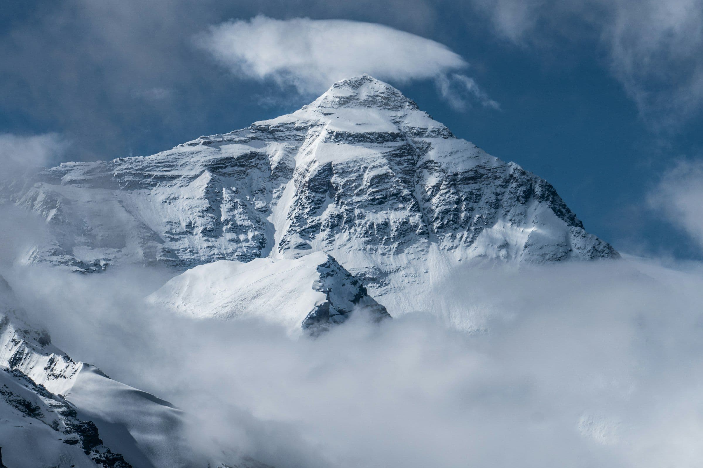 Summit pyramid of Everest rising through a sea of cloud